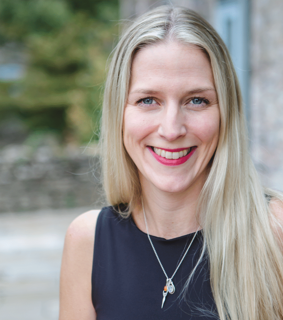 Portrait of Belinda, WellHer blog contributor, smiling warmly against a soft natural background.